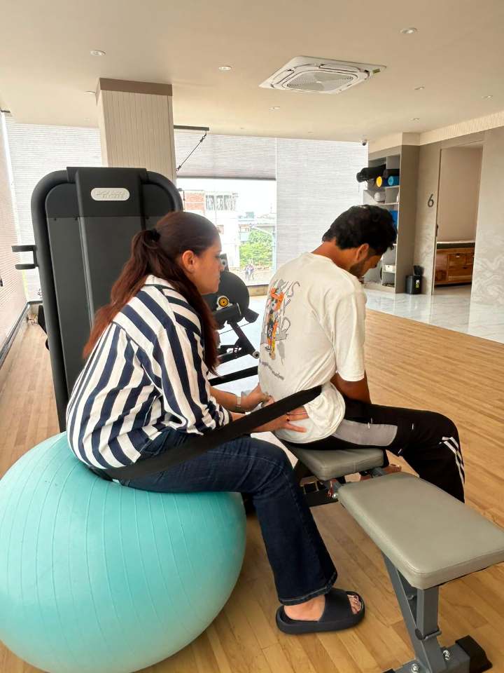 Hands-on manual therapy during a rehab session at Trivayu Physio Center