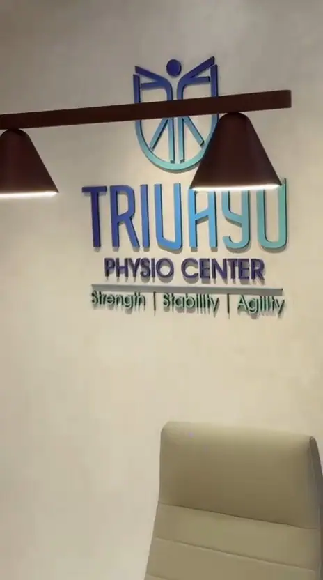The Trivayu Physio Center name on the wall